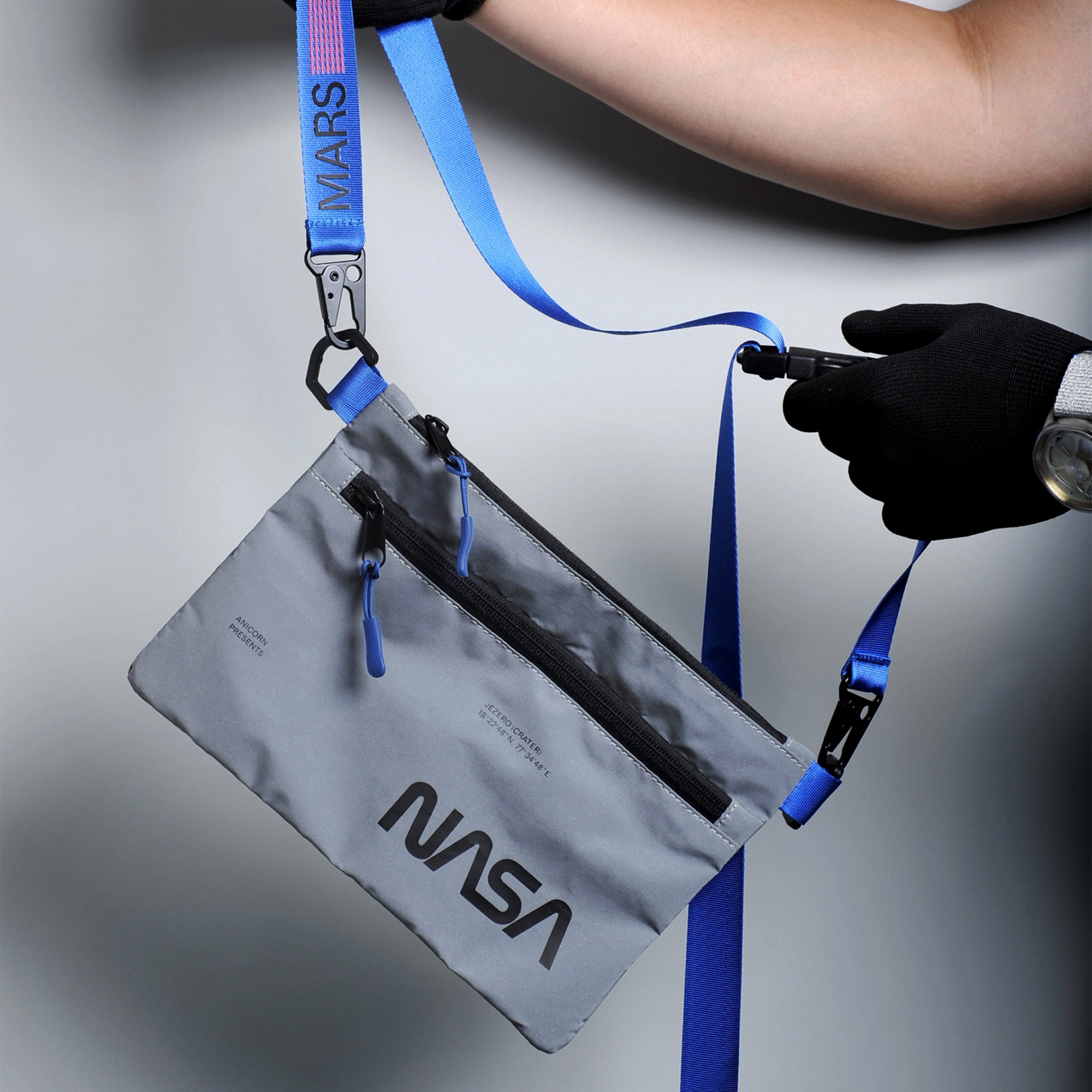 NASA astronautical wear inspired messenger bag made with reflective and waterproof textile. A collaboration with Elephat Urban Equipment.
