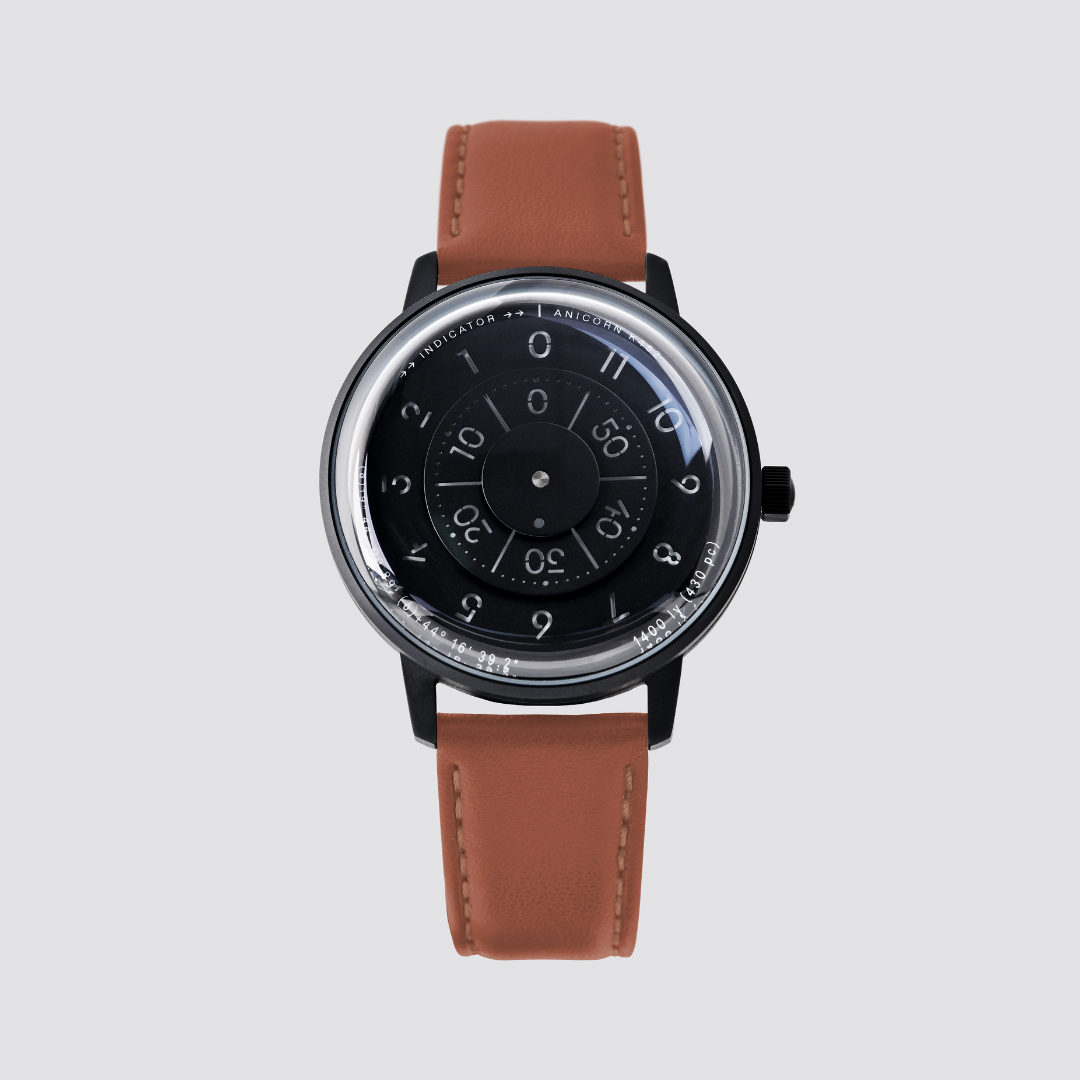 Anicorn K452 Nemesis black watch with a rotating disc dial and brown leather strap.