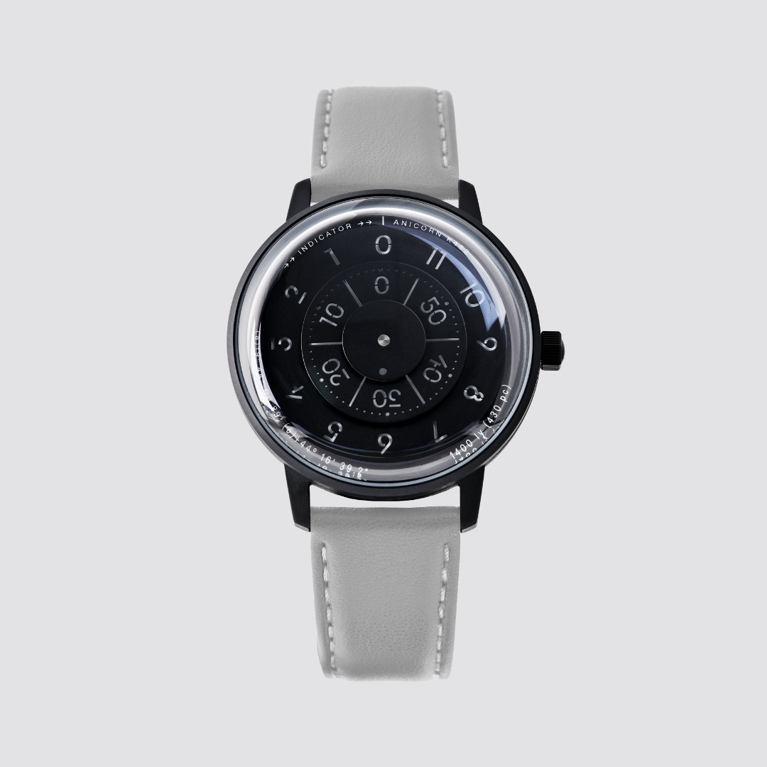 Anicorn K452 Nemesis black watch with a rotating disc dial and gray leather strap.