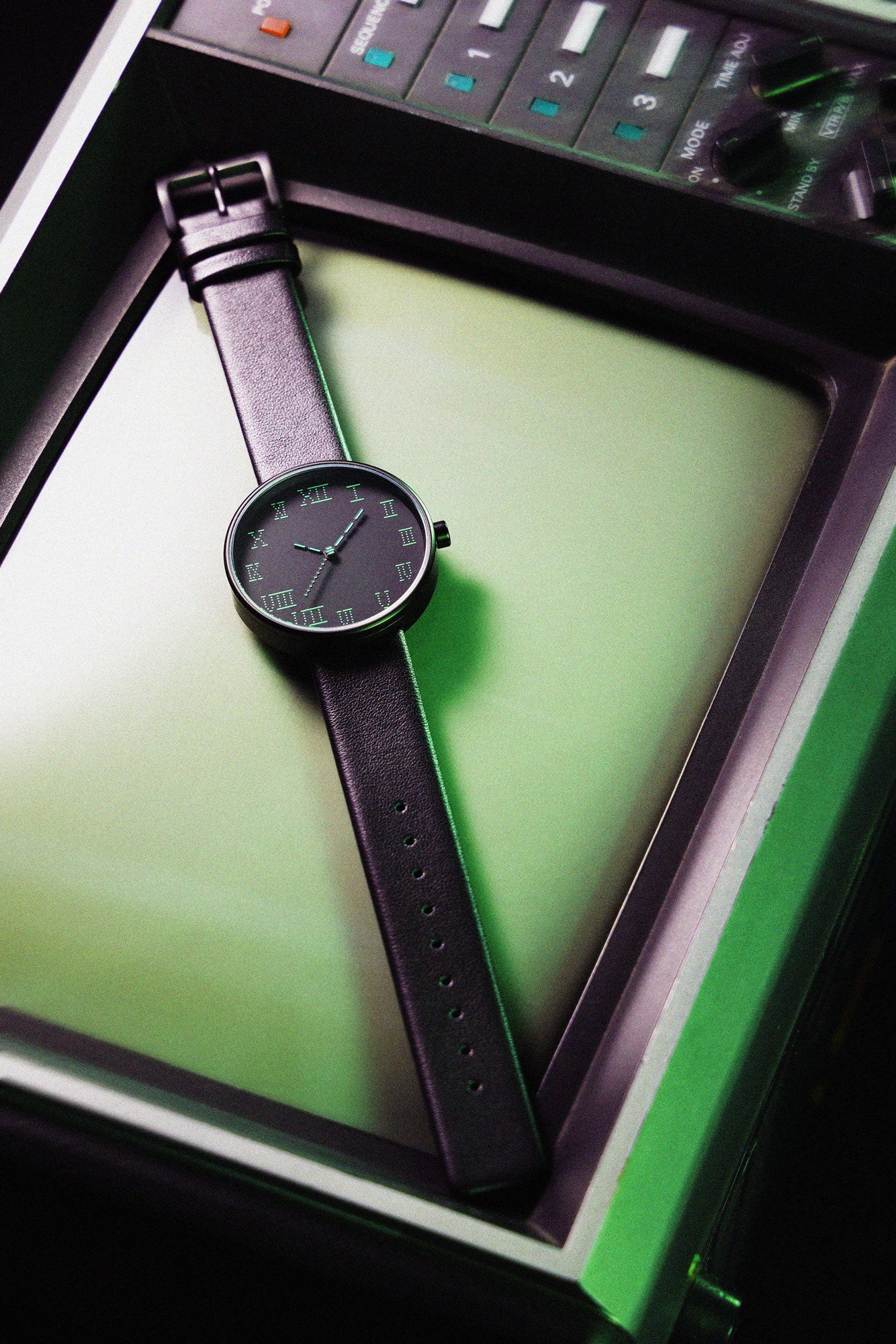Showcasing the front view of the TTT - ACTUAL SOURCE - THERMAL watch against an LCD monitor background, adding a touch of retro nostalgia.