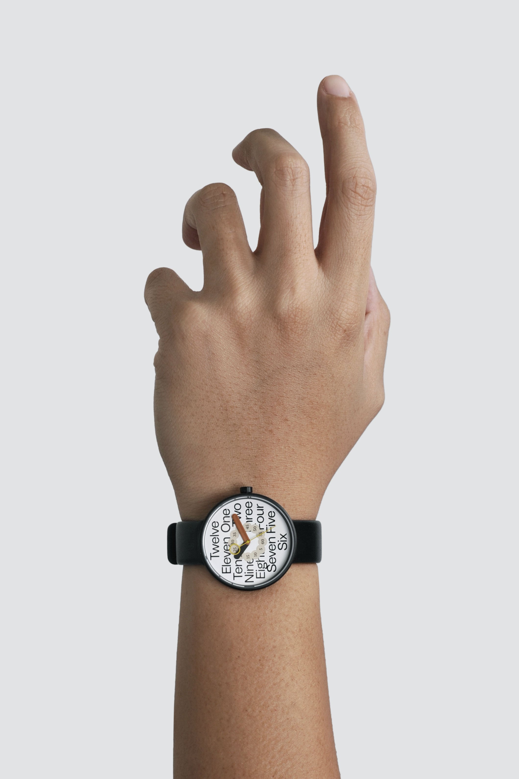 A man's hand with a TTT - 10 Years of TDF watch on it.