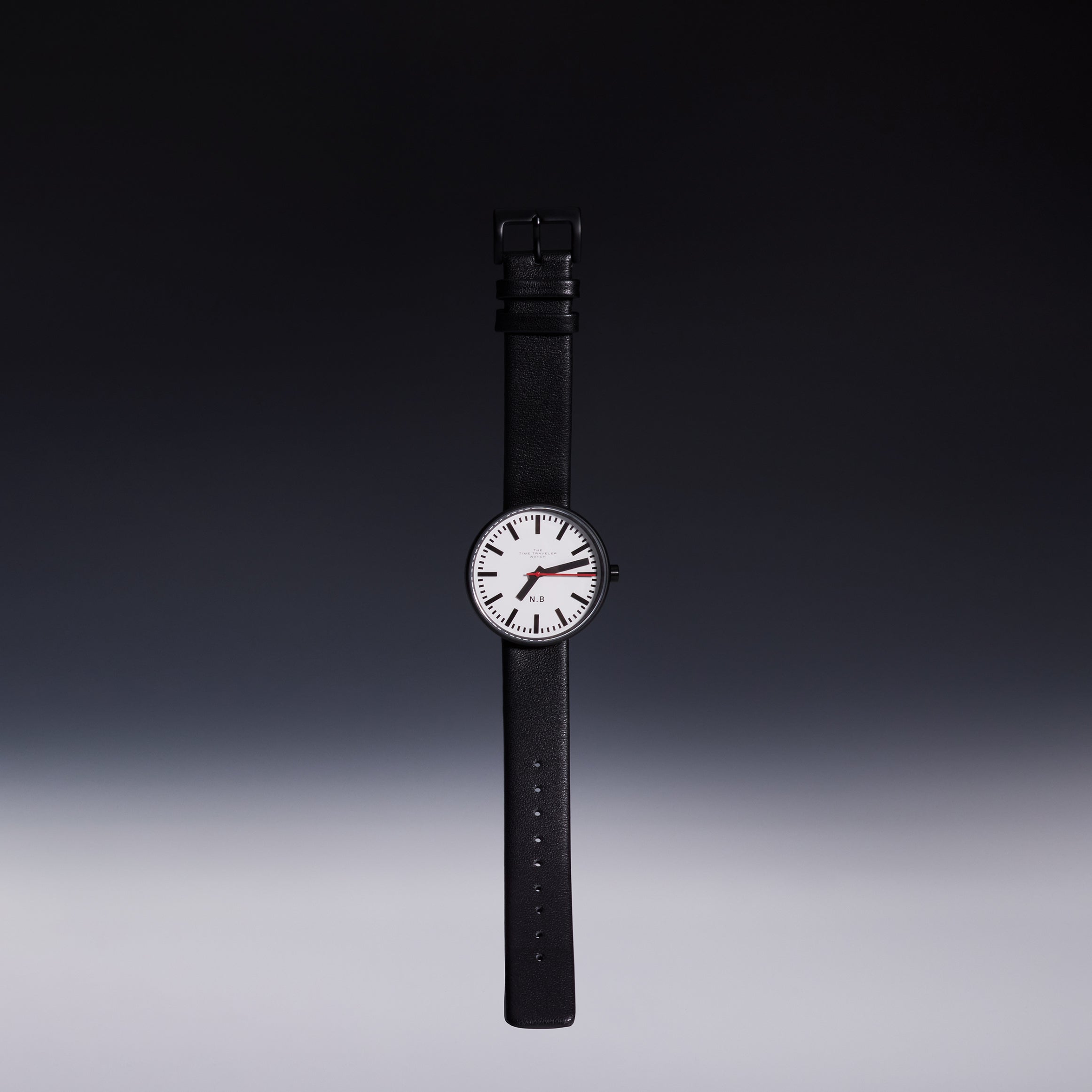 Showcasing the TTT - The Time Traveler Watch by Nik Bentel Studio in its entirety, set against a black upper background and a grey bottom background.