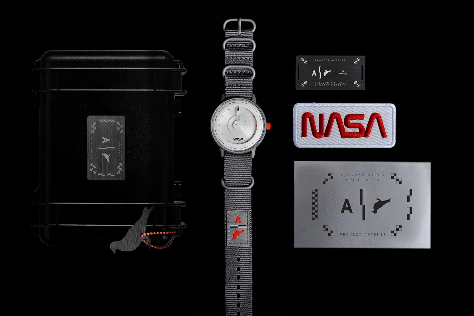 A box-set of "Artemis Time" with a metal number card and a NASA badge next to it