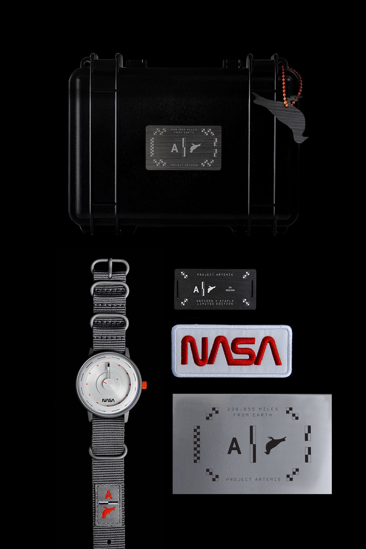 A box-set of "Artemis Time" with a metal number card and a NASA badge next to it