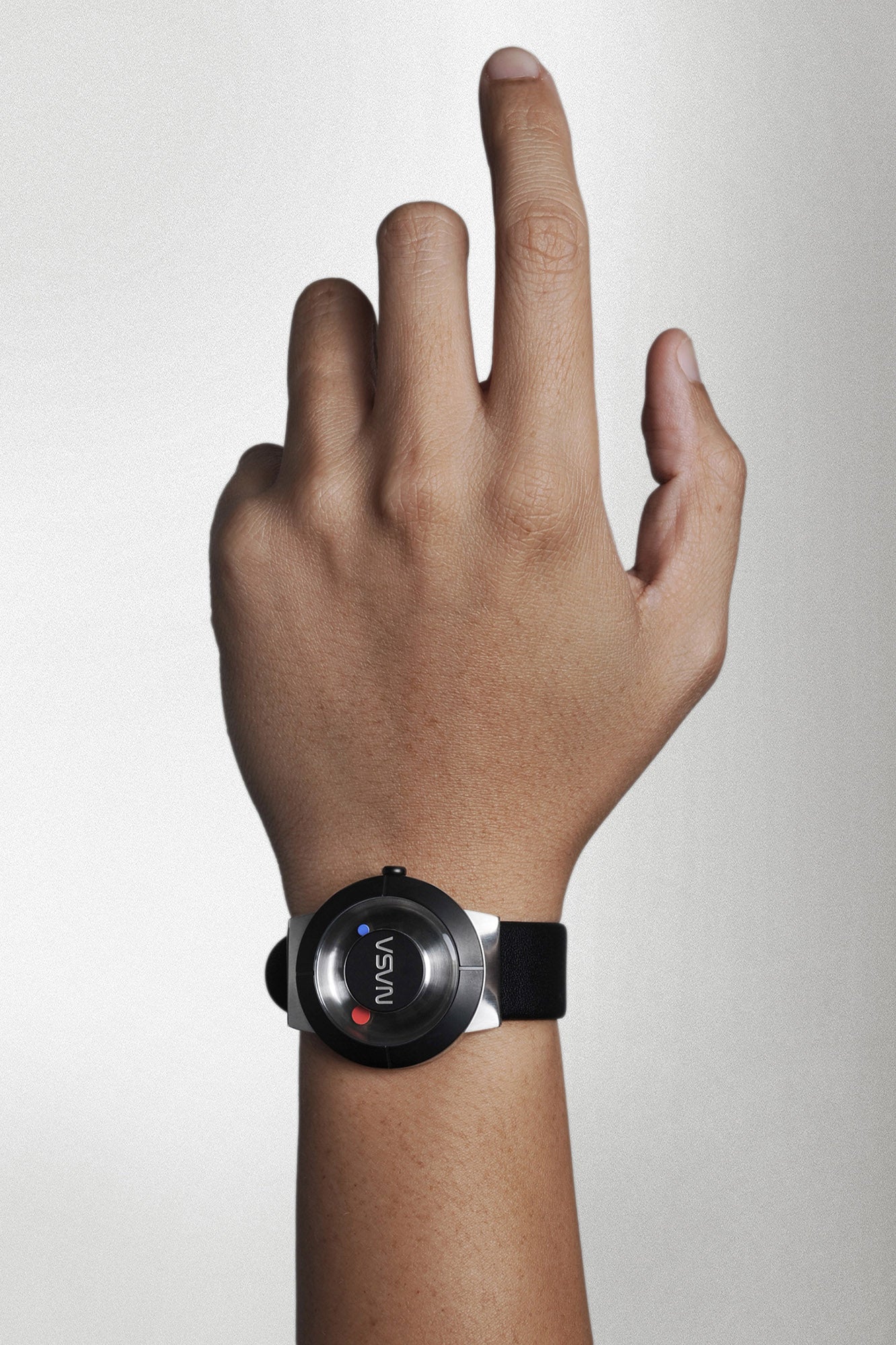 A hand wearing a space watch which inspired by Space itself, “Father of the NASA Design Program” Richard Danne designs his One and Only Space Watch, as homage to his long and fruitful relationship with the NASA family.
