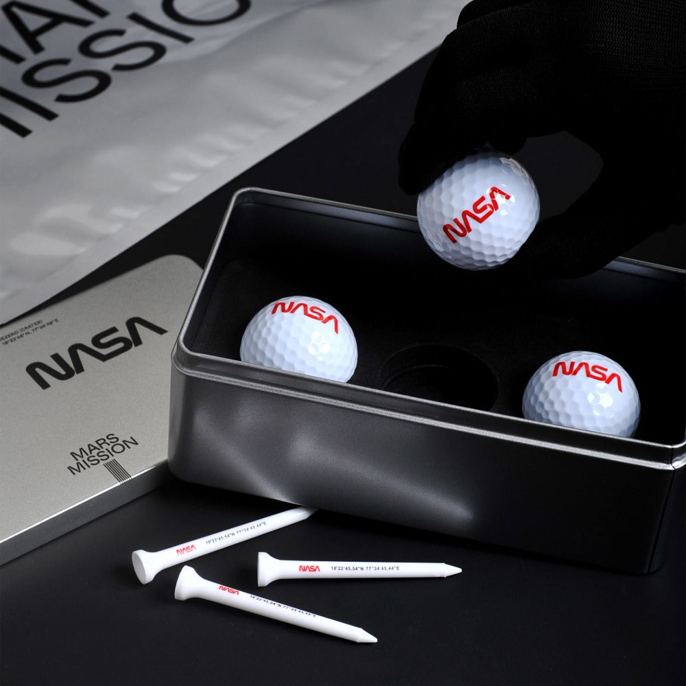 The Mars Swing golf set comes in three balls featuring NASA’s worm logo and three tees printed with coordinates of Jezero Crater in a premium metal case.