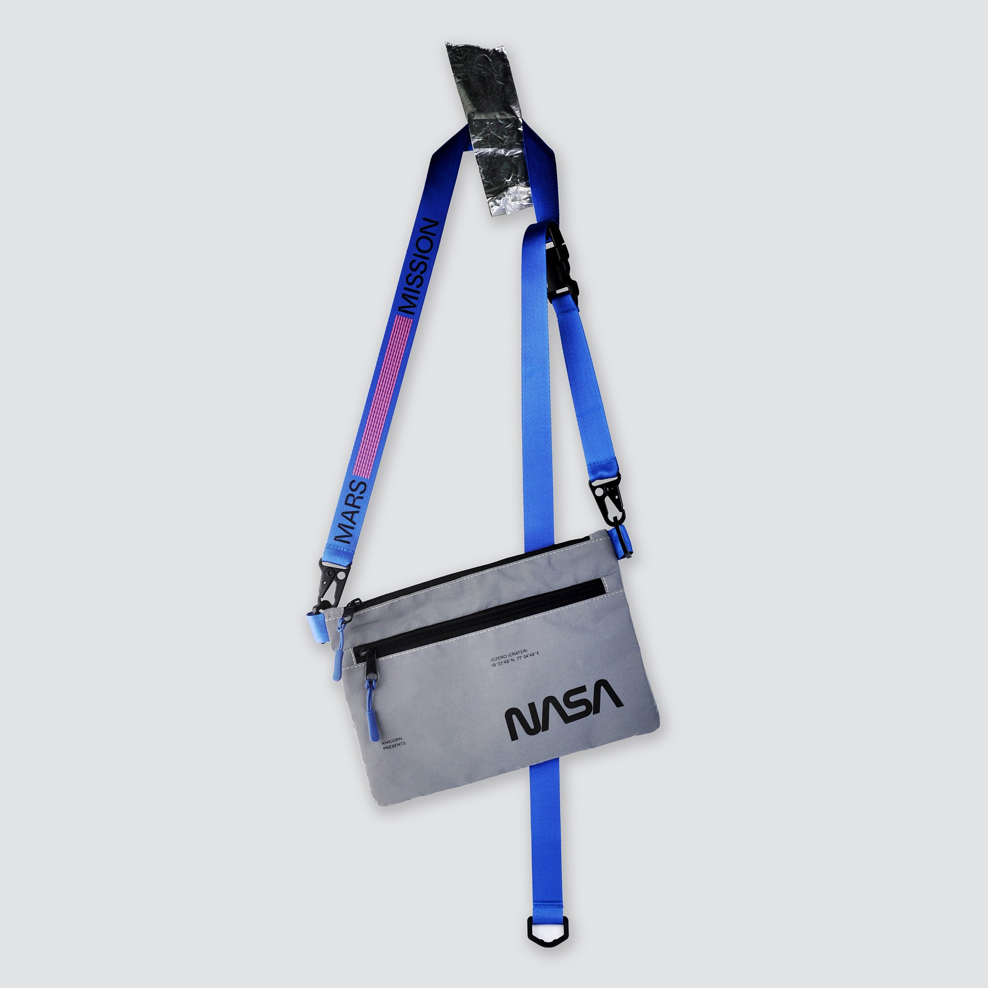 NASA astronautical wear inspired messenger bag made with reflective and waterproof textile. A collaboration with Elephat Urban Equipment.