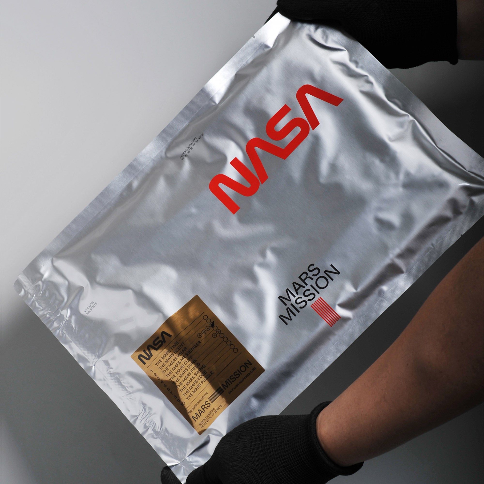 NASA astronautical wear inspired messenger bag made with reflective and waterproof textile. A collaboration with Elephat Urban Equipment.