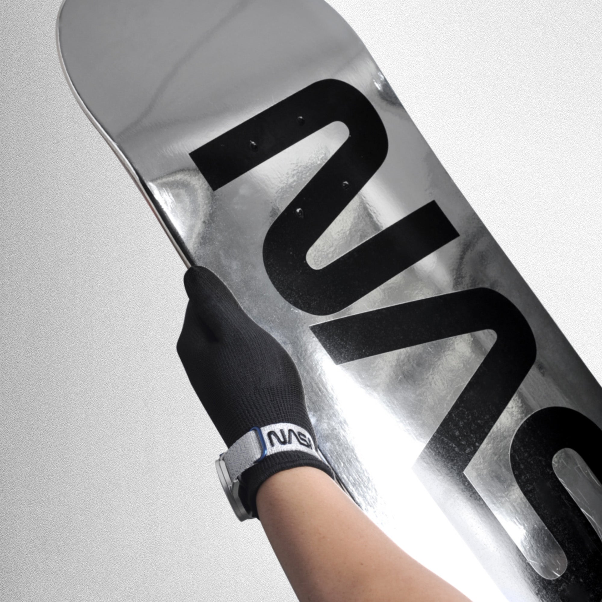 Silvery coated skateboard deck for Mars hovering. The full size (80 x 20 cm / 31 x 8 in) Mars Edge skateboard is made of 7-PLY Grade A Canadian maple wood, it gives durability and flexibility for your hovering mission. The black on silver NASA logo also turns the skateboard into a splendid art piece on the wall. A collaboration with Kurv.